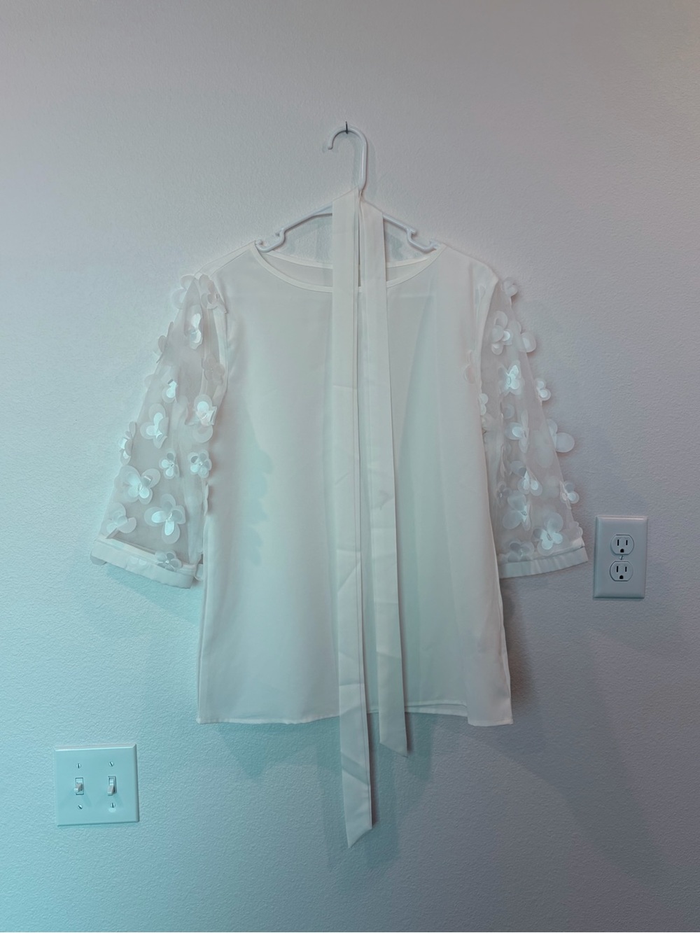 Tie-Neck White Blouse with 3D Floral Sleeves